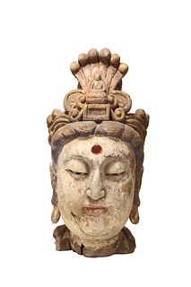 A Carved Wood Head of Buddha