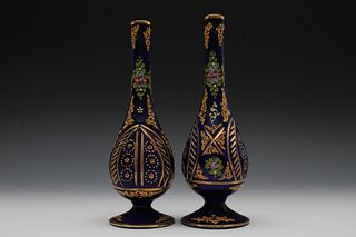 A Pair of Hand Painted Dark Blue Glass Perfume Bottles from the Early 20th Century.

H: Approximately 23cm 