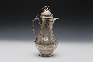 An Islamic Silver Coffee Pot Decorated with Islamic Calligraphy with Rose and Bird Finial.

H: Approximately 21.5cm 
L: Approximately 10.5cm
342g 