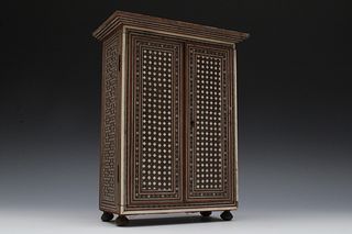 An Iranian Khatam Work Cabinet from the 19th Century.

H: Approximately 28cm
L: Approximately 21.8cm
W: Approximately 11cm 