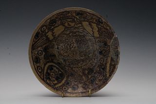 An Islamic Yellow and Brown Glazed Dish with a Female Demon Design.

D: Approximately 18.5cm 
