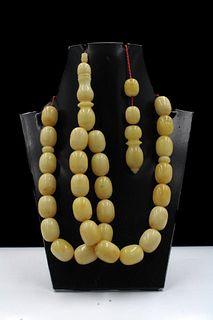 An Islamic Pressed Amber Prayer Beads.

Bead size: Approximately 1.5cm
62g 