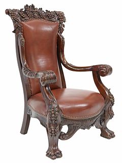 OVERSIZED CARVED MAHOGANY LEATHER UPHOLSTERED ARMCHAIR