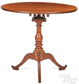 Walnut tilt-top tea table, early 19th c.