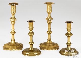 Two pair of English Queen Anne brass candlesticks