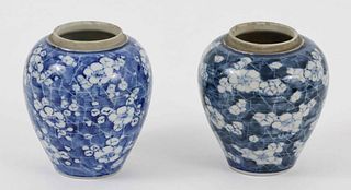 A pair of Chinese blue and white prunus on cracked ice vases, 20th Century