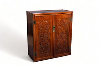 A Chinese wooden two-door cupboard, 19th Century