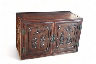 A low Chinese Zitan carved wooden two-door cupboard , 18/19th Century