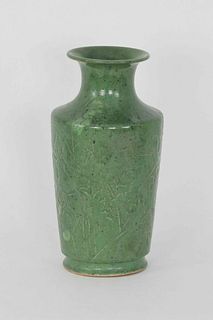 A Korean green glazed vase with floral relief design, 19th/20th Century