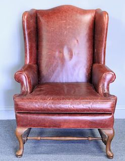 Queen Anne Style Leather Upholstered Wing Chair.