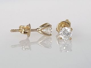 1.40CT  Solitaire diamond stud earrings set in 14K yellow gold. 