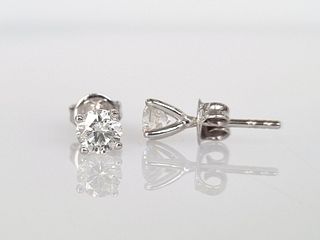 1.00CT  Solitaire diamond stud earrings set in 14K white gold. Each earring is 0.50CT.  A gemological report will be shipped together with the item.