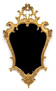 A Pair of Italian Rococo Style Carved Giltwood Mirrors Height 46 x width 27 inches.