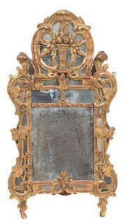 A Continental Carved Giltwood Mirror Height 36 x width 19 1/2 inches.