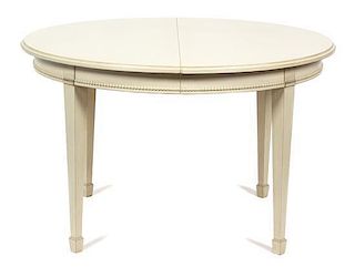 A Gustavian Style Painted Dining Table Height 29 1/2 x diameter closed 46 1/2 inches.