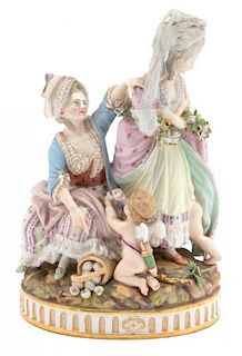 A Meissen Porcelain Figural Group Height 9 1/4 inches.