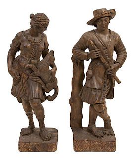 Two Carved Oak Figures Height of taller 42 1/2 inches.