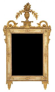 A Louis XVI Style Carved and Parcel Gilt Mirror Height 49 x width 26 inches.