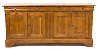 A French Provincial Carved Elm Sideboard Height 40 1/2 x width 86 1/2 x depth 21 1/2 inches.