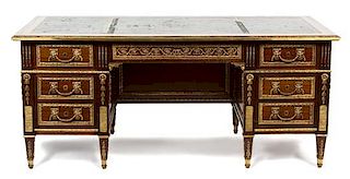 A French Empire Style Mahogany and Ormolu Writing Desk Height 31 x width 72 x depth 35 inches.
