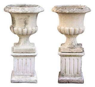 A Pair of Composite Stone Campana Garden Urns Height 35 1/2 x diameter 17 inches.