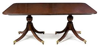 A Georgian Style Mahogany Pedestal Table Height 30 x width 48 x depth 72 inches.