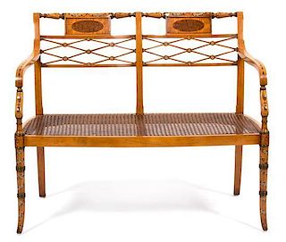 A Regency Style Satinwood Inlaid Settee Height 33 1/3 x width 41 inches.