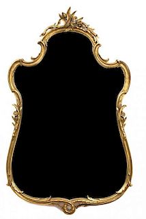 A Victorian Style Carved Giltwood Mirror Height 45 x width 26 3/4 inches.