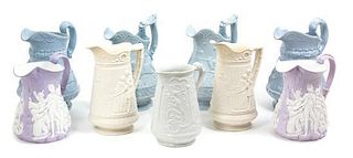 A Collection of English Salt Glaze Stoneware Pitchers Height of largest 11 inches.