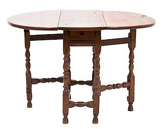 A William and Mary Style Gate-Leg Table Height 29 x depth 34 1/2 inches.