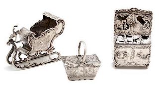 Three Continental Silver Ornaments, Possibly German, 19th Century, comprising a sleigh, a cabinet, and a basket