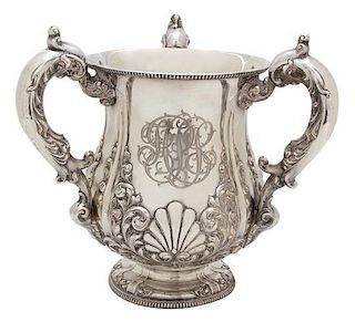 An American Silver Loving Cup, Bailey, Banks & Biddle, Philadelphia, PA, having three C-scroll handles; the urn form body wit