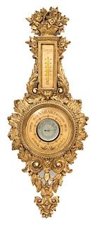 A Louis XV Style Carved Giltwood Barometer Height 40 inches.
