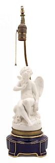 A French Bisque Porcelain Cupid Height of lamp 14 inches.