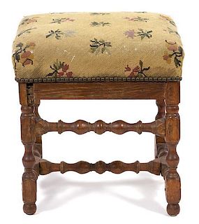 A Jacobean Style Footstool Height 18 x width 17 1/2 x depth 15 1/2 inches.