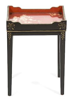 A Regency Ebonized and Gilt Decorated Side Table Height 18 x width 13 x depth 9 1/2 inches.