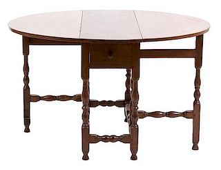 A William and Mary Style Gate-Leg Table Height 26 1/2 x width 37 inches.
