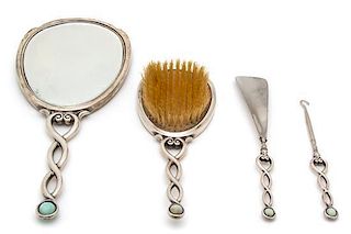 An Art Deco Silver Vanity Set, International Silver Co., New Jersey, 20th Century, with enamel and dolphin form mother-of-pea