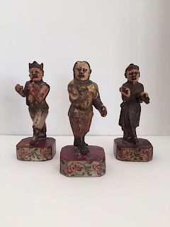 Three Chinese Polychrome Painted and Parcel-Gilt Carved Wood Figures Height 7 1/2 inches.