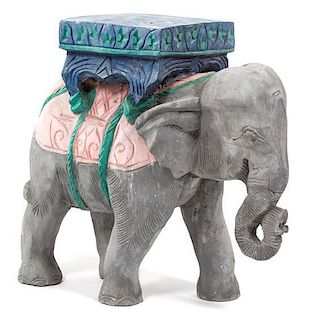 A Carved and Painted Wood Elephant-Form Table Height 19 inches.