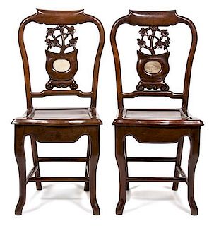 A Pair of Chinese Carved Hardwood Side Chairs Height 36 1/2 x width 16 1/4 x depth 16 1/2 inches.