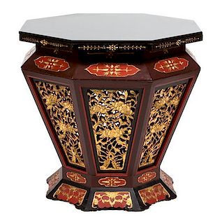 A Chinese Lacquered and Gilt Carved Drum Table Height 29 1/2 x diameter 33 inches.
