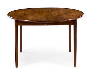 A Circular Danish Teak Dining Table, with three leaves