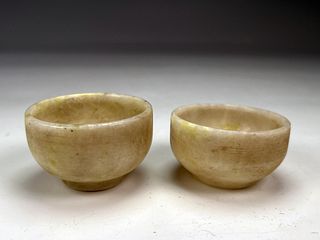 TWO SMALL JADE TEA CUPS