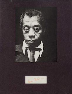 (AUTOGRAPH) BALDWIN, JAMES. A clipped signature, in red ink, of Baldwin's autograph. Matted and framed. Framed: 35 x 28 cm.