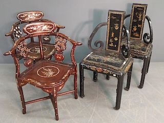 Black lacquered armchairs