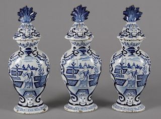 Three Delft garniture vases and covers, 18th/19th c., 13 1/2'' h. Provenance: Rentschler collection
