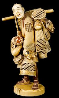 Japanese Meiji period carved ivory figure of a basket seller, 10'' h.