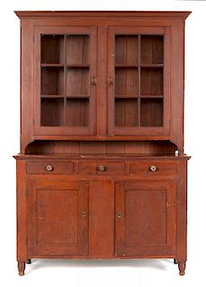 Pennsylvania painted poplar Dutch cupboard, ca. 1835, retaining its original red stained surface,