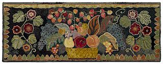 American hooked rug, ca. 1900, with an elaborate basket of fruit flanked by floral sprigs, 25 1/2''